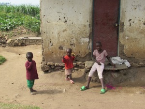 Some children outside of their house.